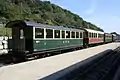 Ehemalige Schweizer Reisezugwagen, vorn B&nbsp;61 (Bj.&nbsp;1910) der Appenzeller Bahn, dahinter C&nbsp;42 (vormals MOB)
