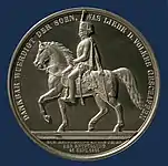 Silberne Medaille auf das Reiterstandbild „zur Erinnerung an die Feier der Enthüllung“ am 21. September 1861, dem 10. Todestag des Monarchen, unter seinem Sohn und Nachfolger König Georg V.;Medailleur Friedrich Brehmer; Münzkabinett des Niedersächsischen Landesmuseums Hannover