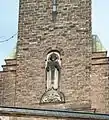 Christkönig-Relief mit Schlange und Greif