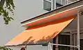 Fallarmmarkise am Flachbau