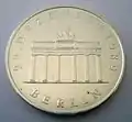 20 Mark der DDR (1990) zur Öffnung der Berliner Mauer am Brandenburger Tor