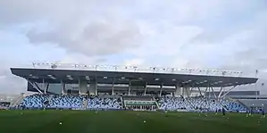 Die Haupttribüne des Manchester City Academy Stadium (Februar 2015)