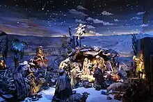 Krippendarstellung mit Geburtshöhle und Nachthimmel; die heiligen drei Könige besuchen das Jesus Kind. Szene von Sebastian Osterrieder.
