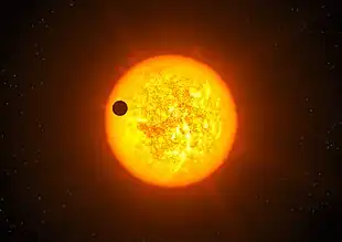 Exoplanet CoRoT-9 b vor seinem Zentralstern (künstlerische Darstellung)