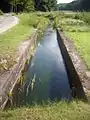 Teil der Betonrinnenanlage am Teich