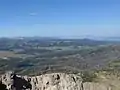 Blick vom Breccia Peak nach Westen, zur Teton Range, Lost Lake im Vordergrund.