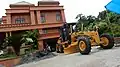 Ein LiuGong CLG414BSIII Grader im Einsatz in Kerala, Indien.