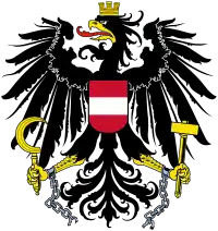 Ein Adler als Schildhalter im Wappen der Republik Österreich (siehe auch Brustschild)