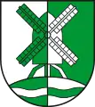 Gespalten von Silber und Grün; darin eine Windmühle auf einem mit einem Wellenbalken belegten Berg, alles in verwechselten Farben  (Etingen, DE)