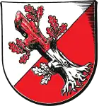 Von Silber und Rot schräglinks geteilt, darauf in vertauschten Farben ein Eichenstumpf (Wahlstedt, DE)