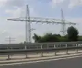 Portalmast für 110&nbsp;kV an der B&nbsp;19 bei Würzburg