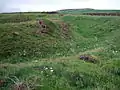 Wallreste eines eisenzeitlichen Promontory Forts, bei Pwll Caerog