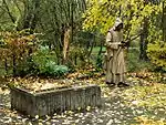 Die Erinnerungsstätte besteht aus einer 2,20 Meter großen Bronze-Statue und einem Modell der Kartause.