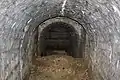 Blick in den versperrten Hohlgang zur Poudriere von Fort Souville,