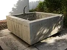 Gedenkbrunnen für Theophil Roniger, Magden, Christkatholische Kirche St. Martin