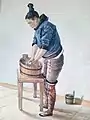 Grönländische Frau beim Wäschewaschen