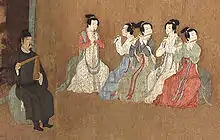 „Nachtbankett des Han Xizai“. Der Hofmusikdirektor links mit einer Klapper paiban, die Frauen spielen zwei Doppelrohrblattinstrumente guan und drei Querflöten dizi. Gemälde des 12. Jh.