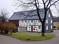 Wohnhaus in teilverschieferter Fachwerkbauweise in Wüste (2003)