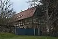 Wohnstallhaus, Einfriedungsmauer und Toranlage eines Zweiseithofes