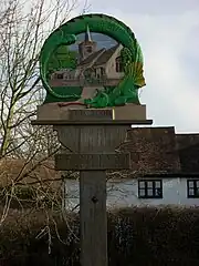 Dorfschild von Henham mit Drachendarstellung