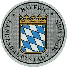 Zulassungsplakette der Landeshauptstadt München mit dem bayerischen Staatswappen bis 2014