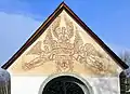 Sgraffito an der Giebelwand der Ruhestätte der Familie Walter am Zentralfriedhof Annabichl, Klagenfurt am Wörthersee