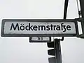 Beispiel eines West-Berliner Straßenschildes mit kantigem ß