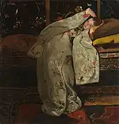 Meisje gekleed in een kimono, achterover liggend op een bank, 1894