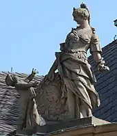 25. Prudentia (Klugheit) – Putto, Schuppenpanzer, Schlange, lorbeerumkränzter Schild mit Porträt eines Ehepaars.