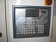 Programmtastatur eines Reinigungsautomaten in einem deutschen Pelzreinigungsbetrieb