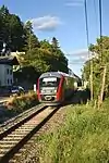 Ein Desiro-Triebzug am Grünbacher Sattel, dem höchsten Punkt (678 m ü. A.) der Normalspurstrecke