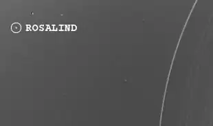 Bild vom Uranusmond Rosalind und einigen Uranusringen
