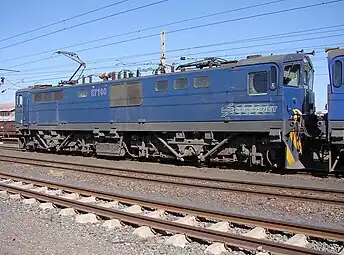 E7100 im blauen Spoornet-Anstrich mit umrandeten Nummern in de De Aar am 26. August 2007