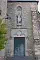 Seitenportal mit der Statue Johannes des Täufers