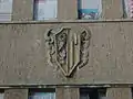 Stadtwappen an der Fassade des Sachsenbades