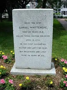 A picture of a monument for Samuel Whittemore with the inscription "Near this spot, Samuel Whittemore, then 80 years old, killed three British soldiers, April 19, 1775. He was shot, bayoneted, beaten and left for dead, but recovered and lived to be 98 years of age."