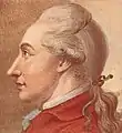 Johann Wolfgang Goethe in der roten Jacke mit Haarband nach links