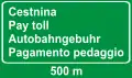 mehrsprachiger Hinweis auf eine Mautstelle in 500 m