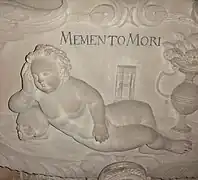 Stiftskirche St.&nbsp;Georg, Tübingen. Detail von einem der Grabmonumente: Memento mori. Dem Stil nach (Putte) aus dem Barock.