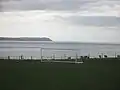Oa jenseits von Loch Indaal vom Sportplatz von Port Charlotte aus gesehen.