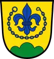 AußernzellIn Gold über einem grünen Dreiberg eine blaue heraldische Lilie, umgeben von einer blauen Kette.