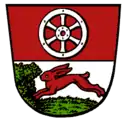Haßloch (Rüsselsheim am Main): Oben im Wappen das Mainzer Rad, unten ein laufender Hase.