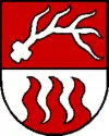 aus dem Schildfuß aufsteigende Flammen (Kronstorf AT)