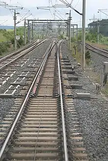 EW 60-7000/​6000-1:42 am Abzweig Rohrbach in der Schnell­fahr­stre­cke Han­nover–Würz­burg mit drei An­trie­ben (in Betrieb seit 1994)
