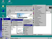 Der Explorer in Windows&nbsp;98; im Vordergrund das aufgeklappte Startmenü mit der Taskleiste (unten), dahinter der Dateiverwalter mit dem Spezialordner Arbeitsplatz (im Hauptfenster) und im Hintergrund der Desktop
