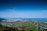 Blick über die Ebene nach Westen (am Horizont die Insel Guishan Dao)